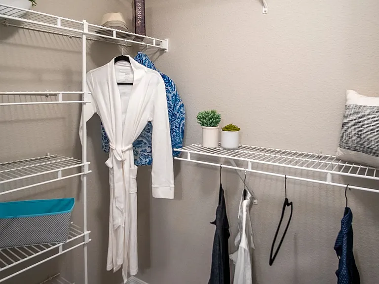 Organize in style with Eagle's Pointe walk-in closets. Abundant built-in open wire organizers ensure your clothing is always ready to impress.