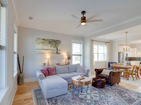 Living room area and view of dining area.