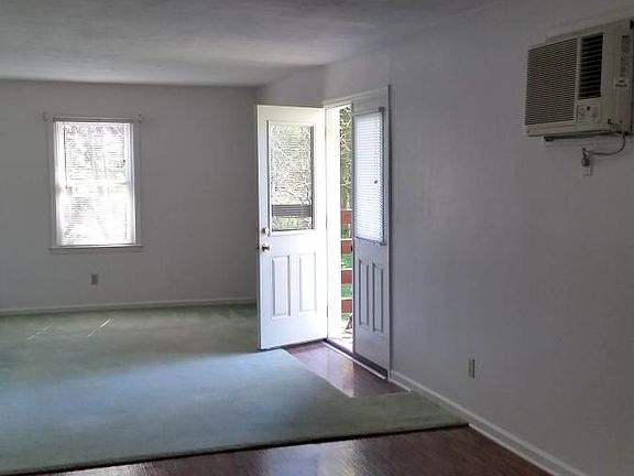 Doors to the den open to a deck