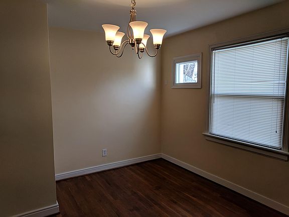 DIning Room w/ Wood Floors and Chandelier