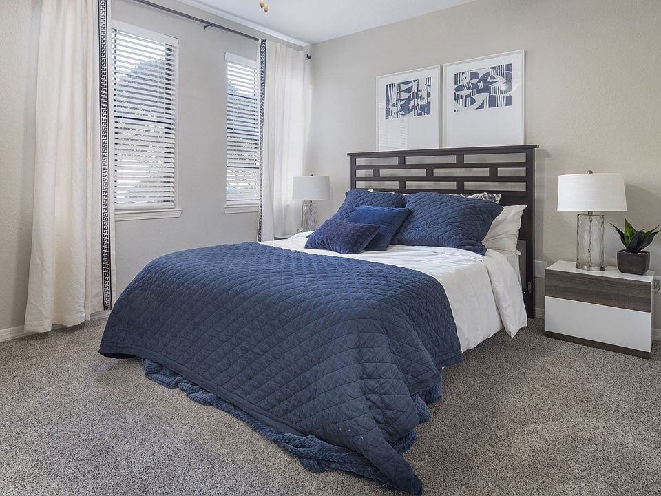 Spacious Bedroom with Modern Furniture and Large Windows