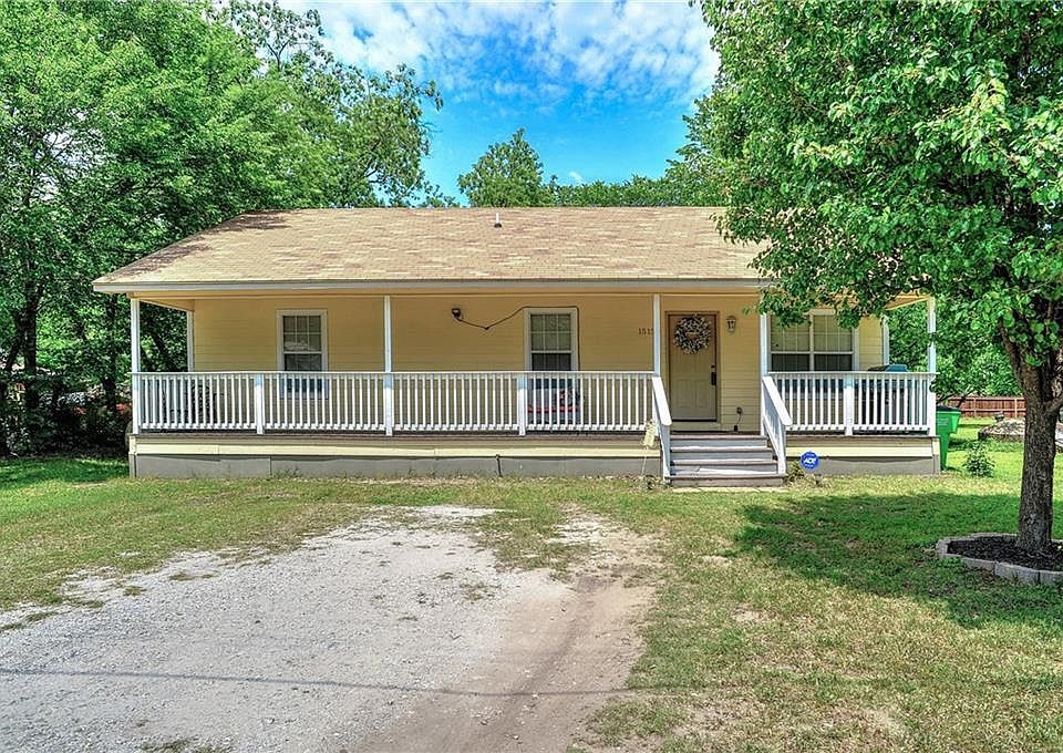 Charming ranch style home has huge front porch and sits on large 1/4 acre lot.
