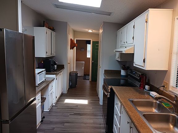 Kitchen facing laundry room 