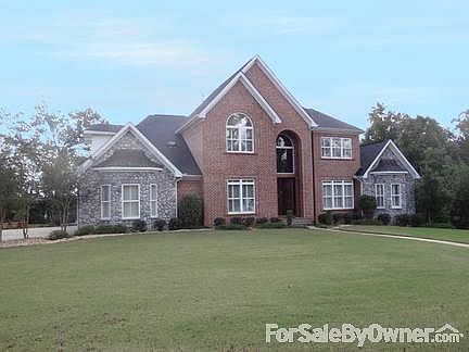 Front of House
						:
						Full brick home with stone and copper accents. Mature Bermuda grass & shrubs.