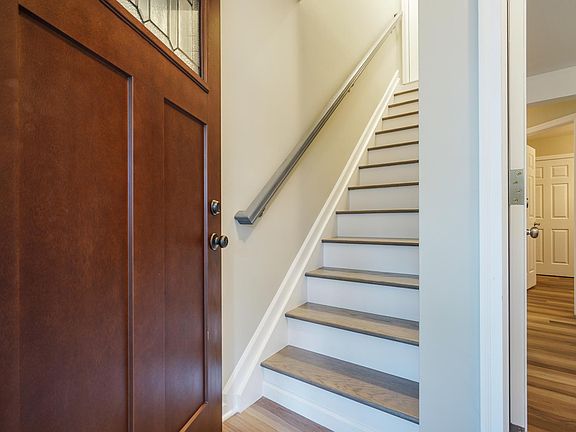 Entry into the home: new stairs to the 2nd floor on the left and entrance to the 1st floor on the right.
