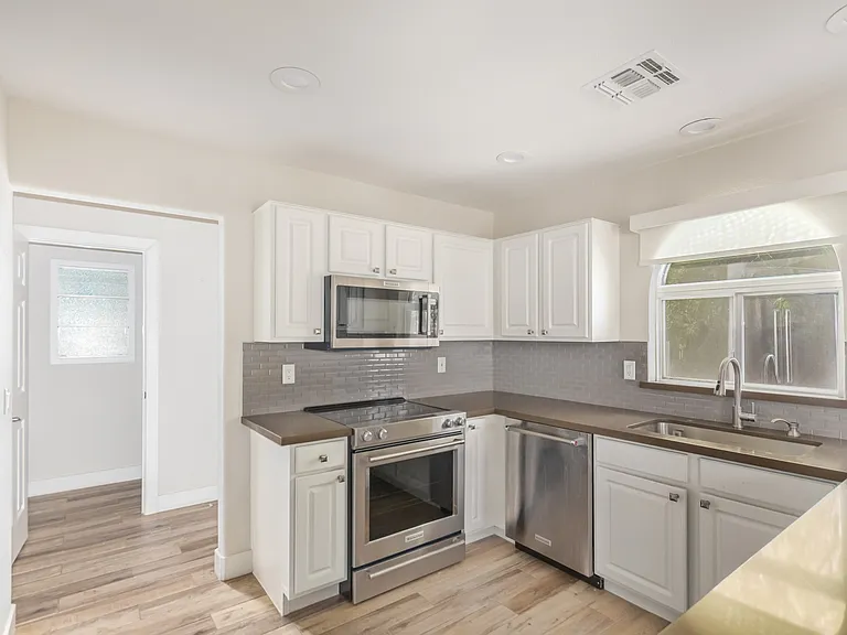 Kitchen with all the appliances.