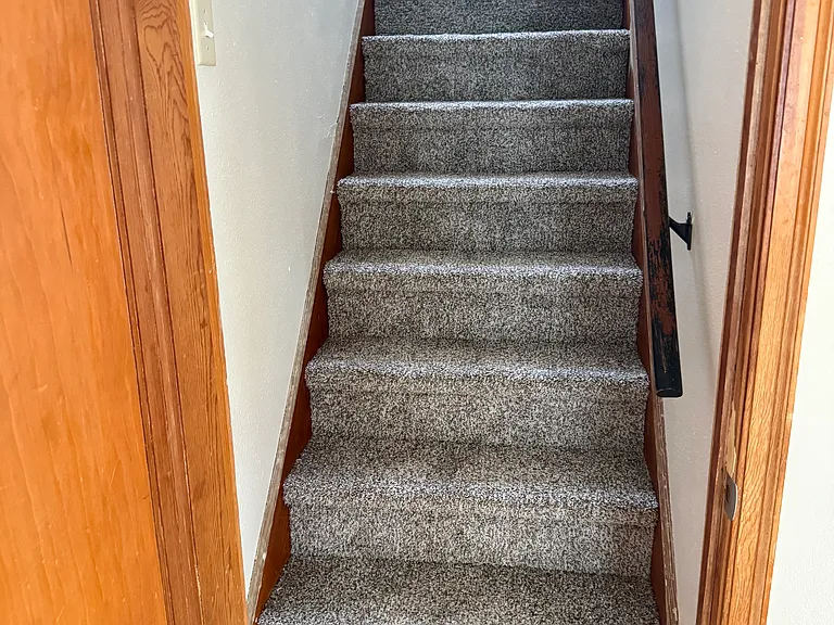 Stairs to second level with new carpet.
NOTE:there is a full basement with washer/dryer hookups as well