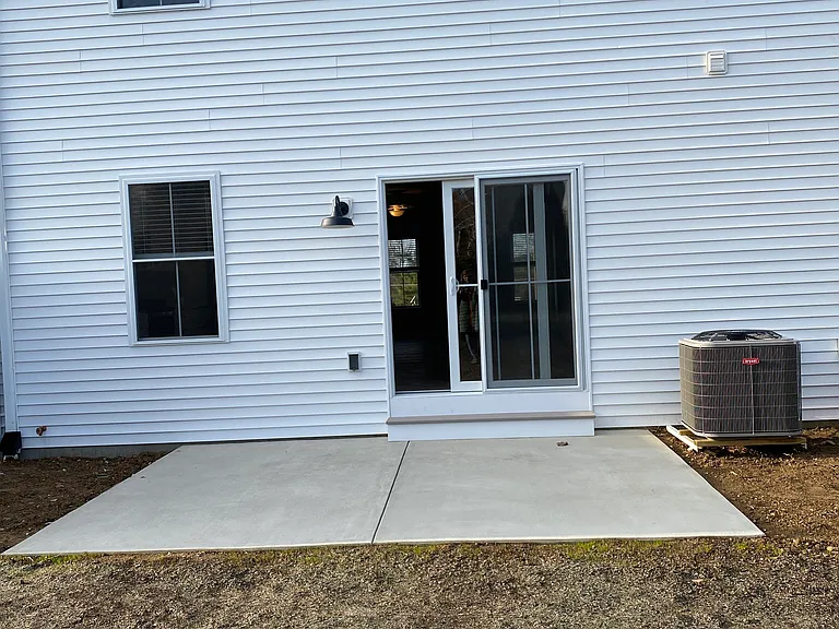 Back patio, shown here at construction