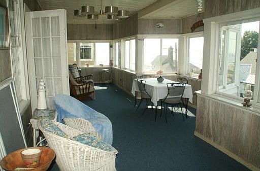 Awesome waterviews from this enclosed wrap around porch