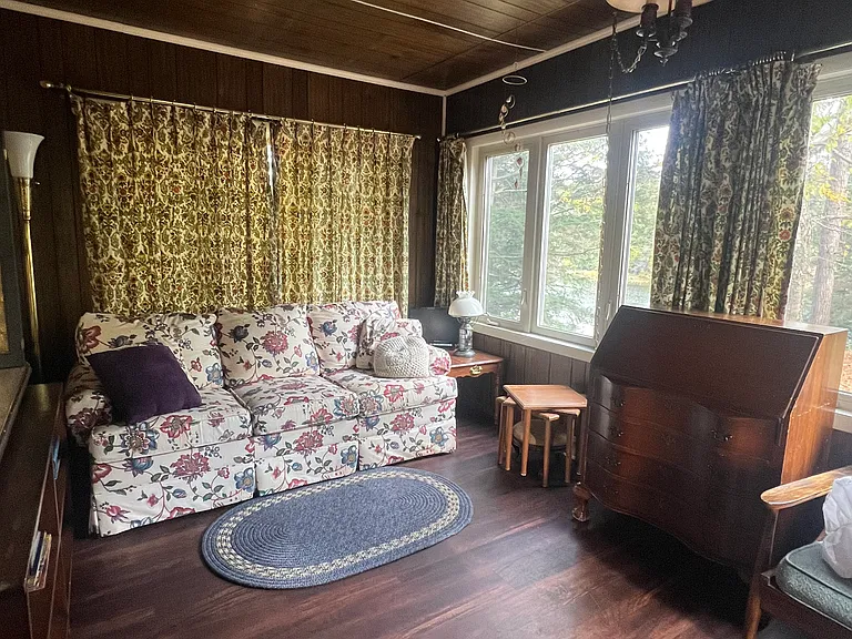 Sunroom has pullout for guests accommodations. Lake front property rental Upper Peninsula #VacationRental