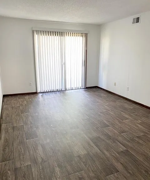 View of family room and private 2nd floor balcony.