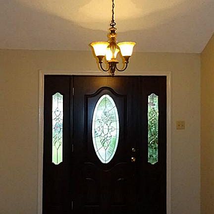 Spacious entry, laminate floors throughout house, high ceiling with updated ceiling fans and light fixtures