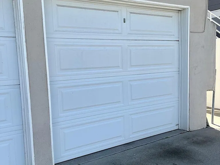 Single car garage with opener and access to unit.