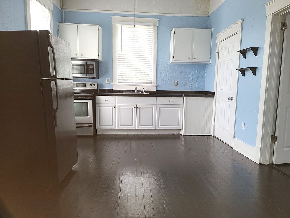 Huge kitchen with fridge, stove & microwave. 
No dishwasher