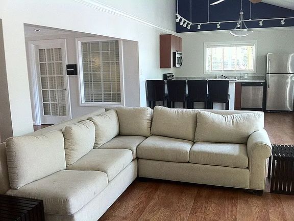 clubhouse wifi TV lounge with kitchen seen in the background