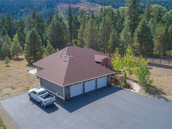 RV hookup here! The propane tank is owned & buried. Shop gas prices! The garage is about 1200sf. Shelving stays. Fully insulated with drains. Wine fridge & beer fridge in garage stay.