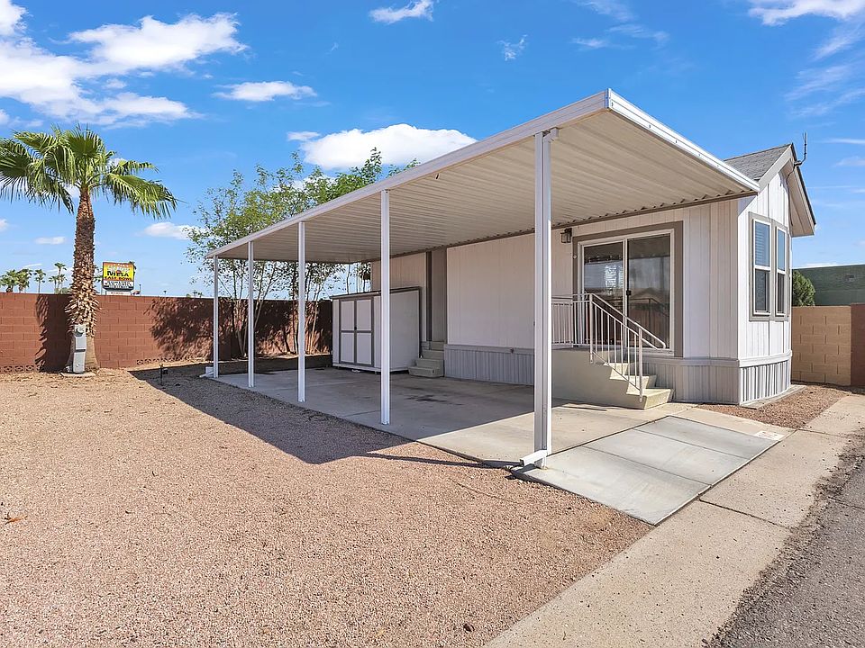 Side of the house with shed that has washer and dryer hookups