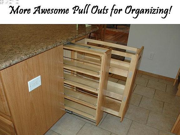 Lots of custom features to this gorgeous kitchen! Check out these can or spice shelves.