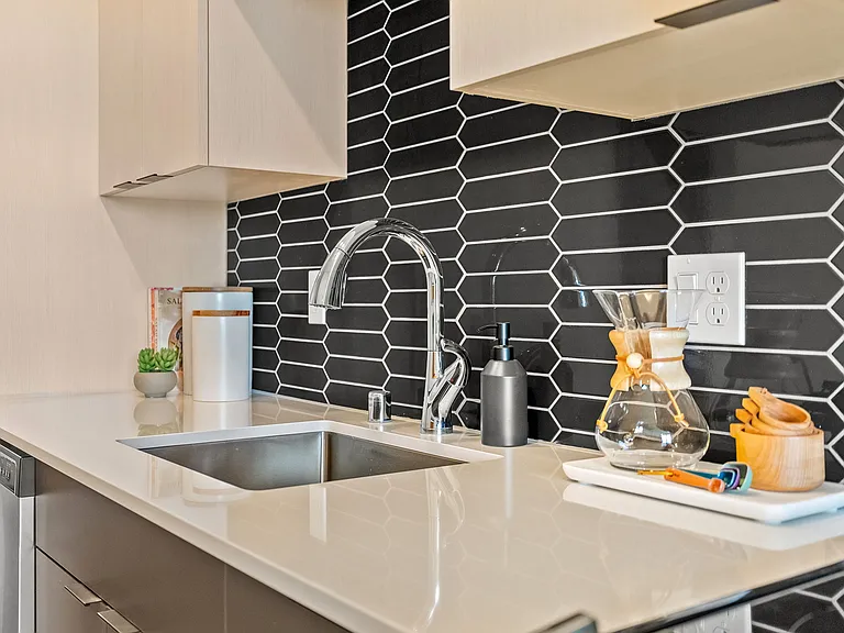 Elevate your kitchen: Enjoy sleek quartz countertops paired with a contemporary backsplash, blending modern style with practical elegance. ____