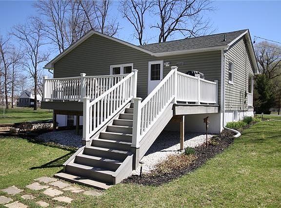 Large Trex deck with access to the kitchen. Wonderful for entertaining or just relaxing while listening to the quaint stream below.