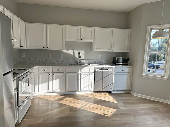 Kitchen with new appliances and new quartz counters