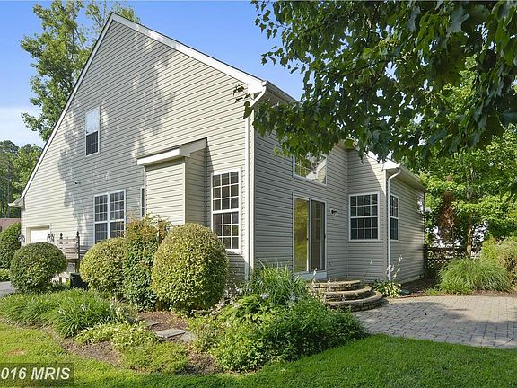 Landscaping surrounds the home