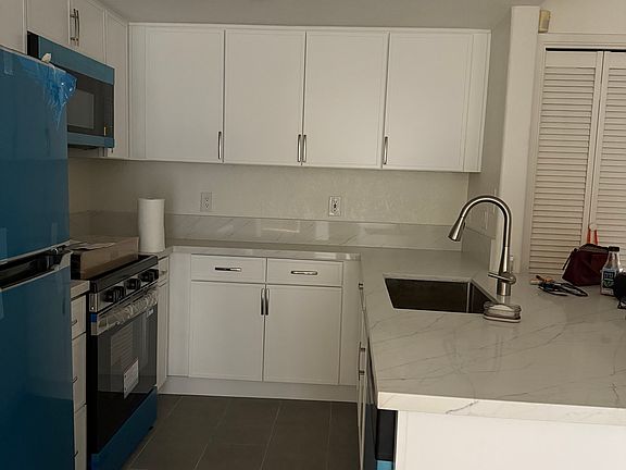 New kitchen and stainless steel appliances.