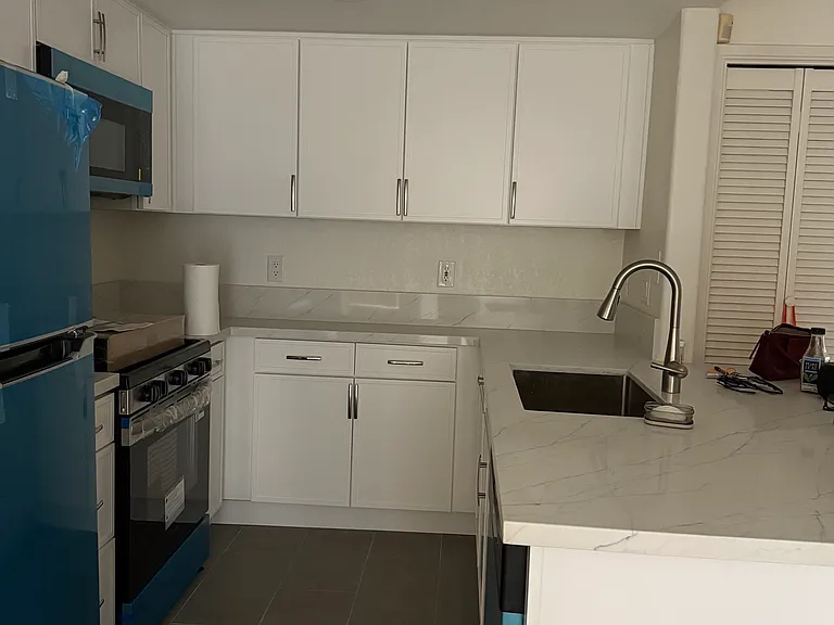 New kitchen and stainless steel appliances.