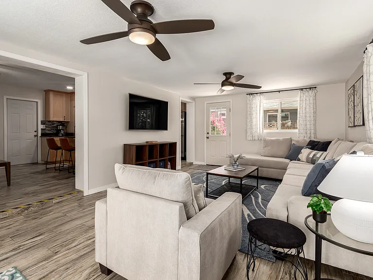 2nd Living Room with comfy sectional, Smart TV, books, games and plenty of natural light!
