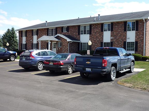 Back of building from parking lot; view of main entrance
