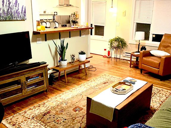 open floor plan to kitchen with gas range and all new appliances