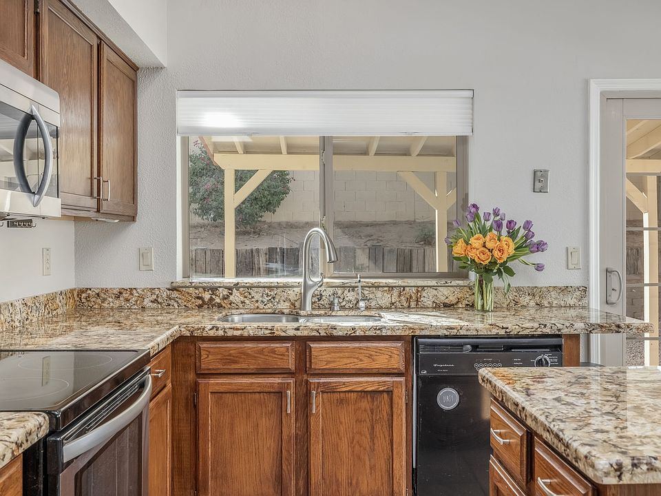 Looking out to your own private backyard makes doing dishes way more fun!