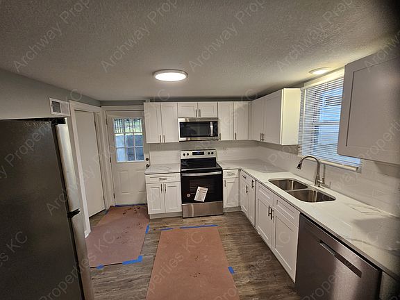Modern Kitchen featuring stunning quartz countertops and brand-new stainless steel appliances!