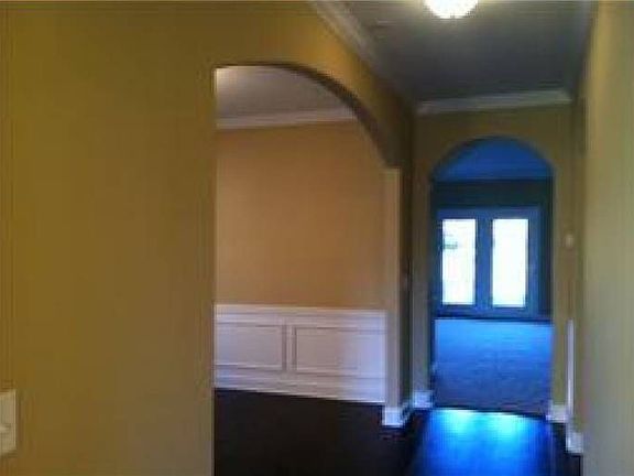 Arched hallways add elega