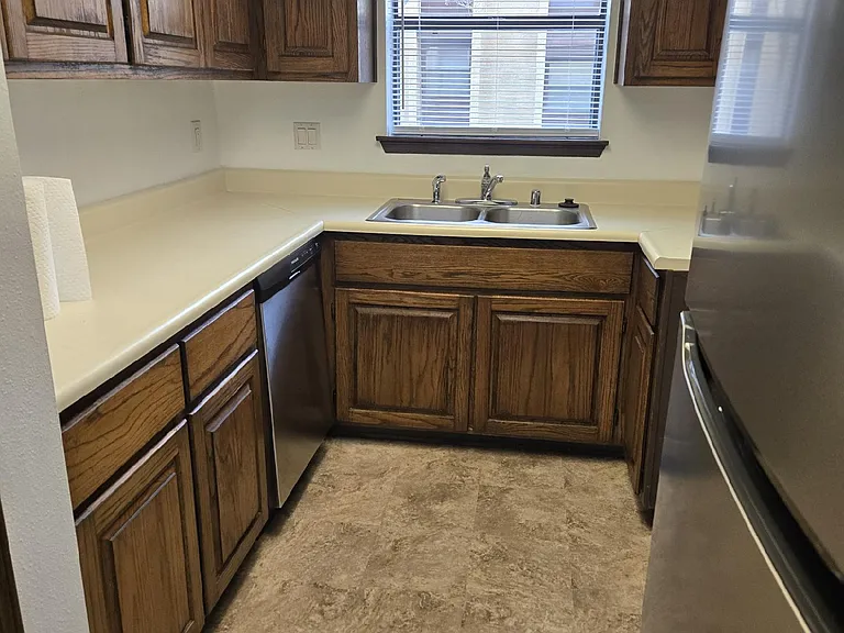 galley kitchen with newer appliances
