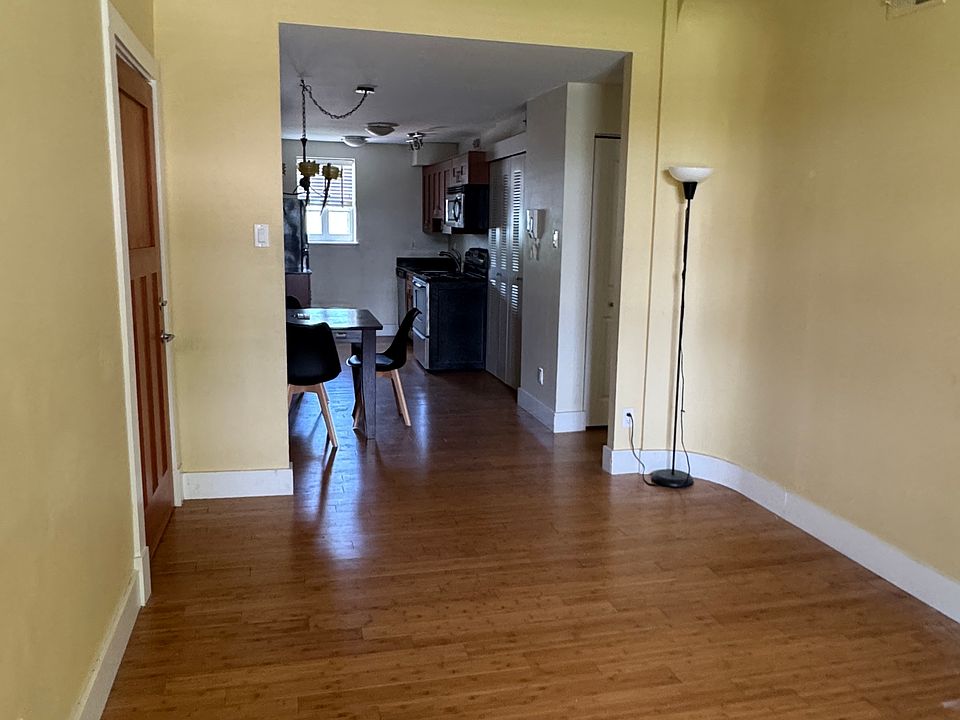 Living and dining area. Spacious open-concept living and dining room with hardwood floors and natural light.