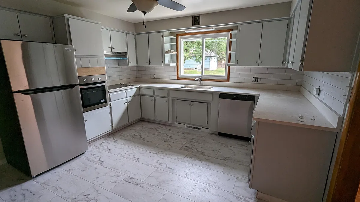 Updated kitchen with stainless steel appliances. - 211 Wainwright Ave