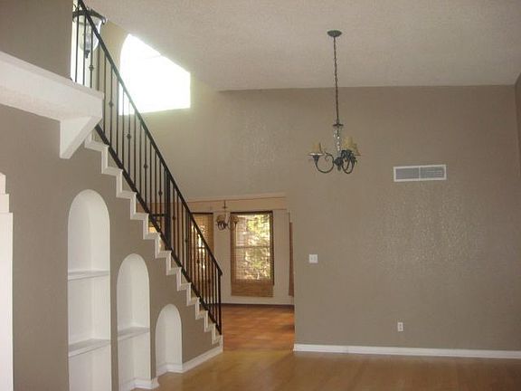 Great staircase with iron and terracotta tile.