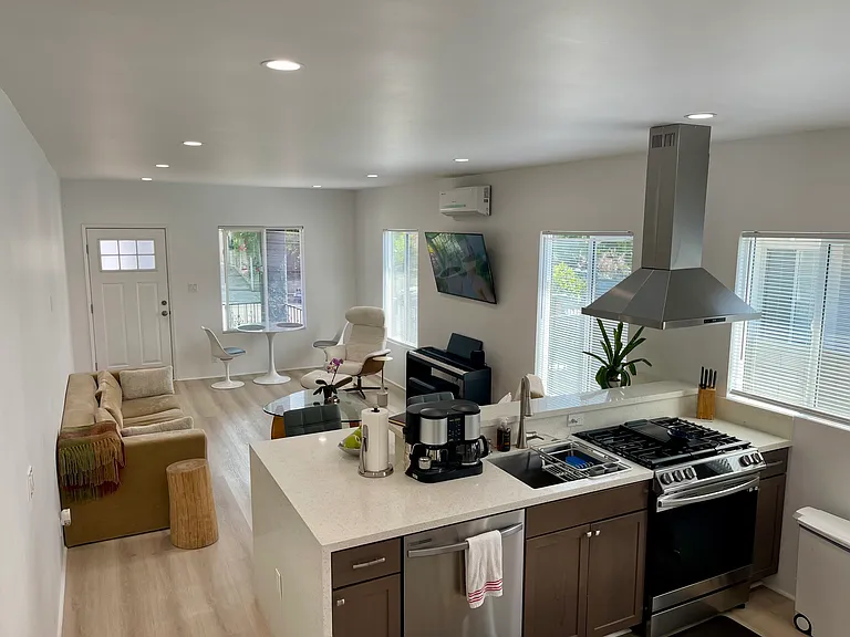 Kitchen features dishwasher, microwave, gas stove and oven with air fryer and convection, garbage disposal, dual door refrigerator with in door ice and water dispenser.