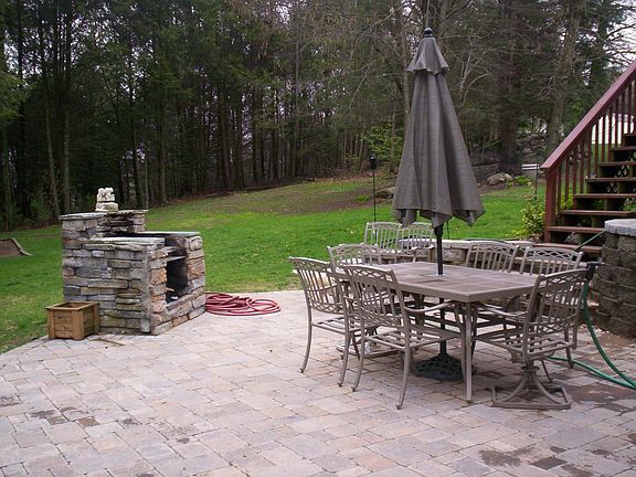 Cobblestone Patio-Stone Raised Hearth Firepit