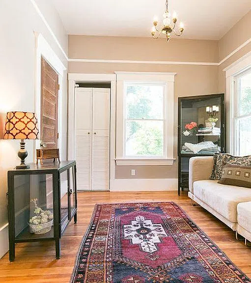 Second bedroom overlooking garden, two closets. Vintage antique floor and original lighting.