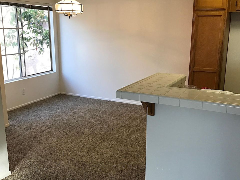 Tiled entrance in kitchen and bath areas as well