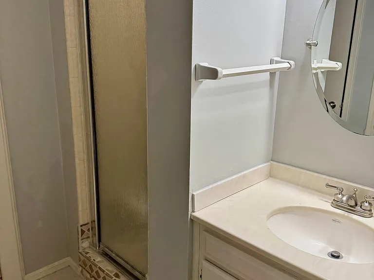 Main bath with private vanity and shower