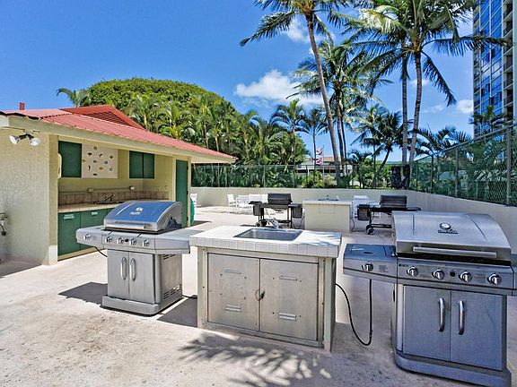 Outside communal barbecue area by the pool