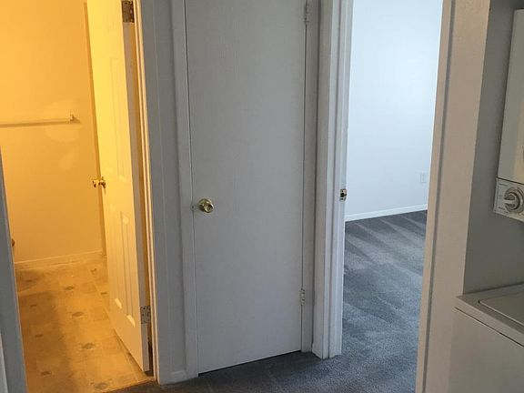 hallway catching glimpse of front bedroom