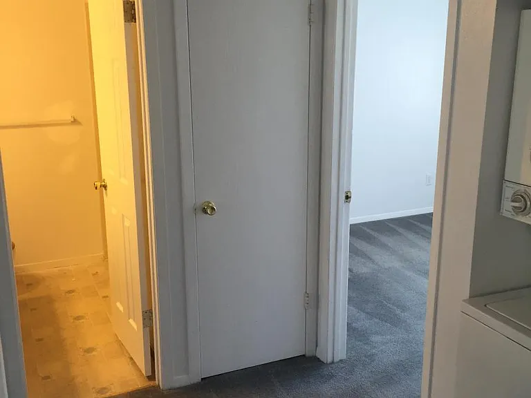 hallway catching glimpse of front bedroom