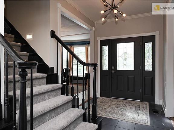 Tiled floor Entry and stairs w/ brand new carpet.