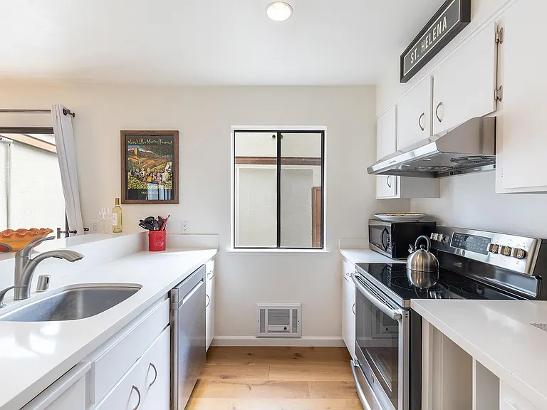 Kitchen with DW, MW, new stove and refrigerator