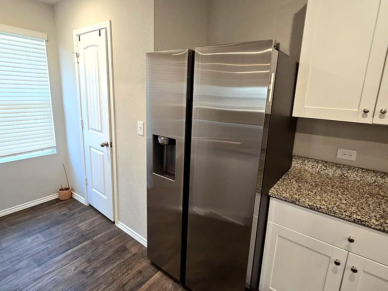 Full kitchen with modern appliances and ample counter space.