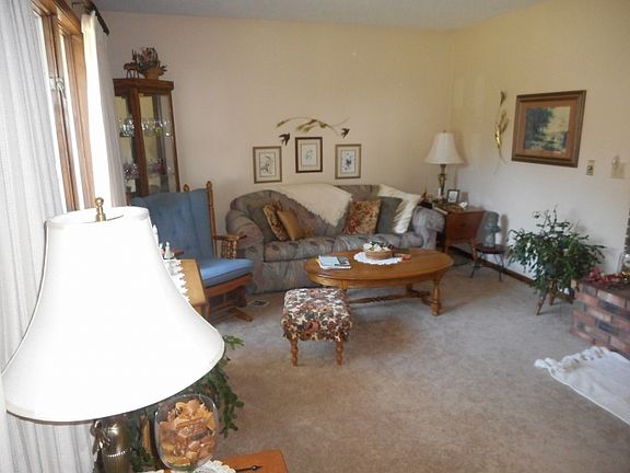 spacious living room with large front windows